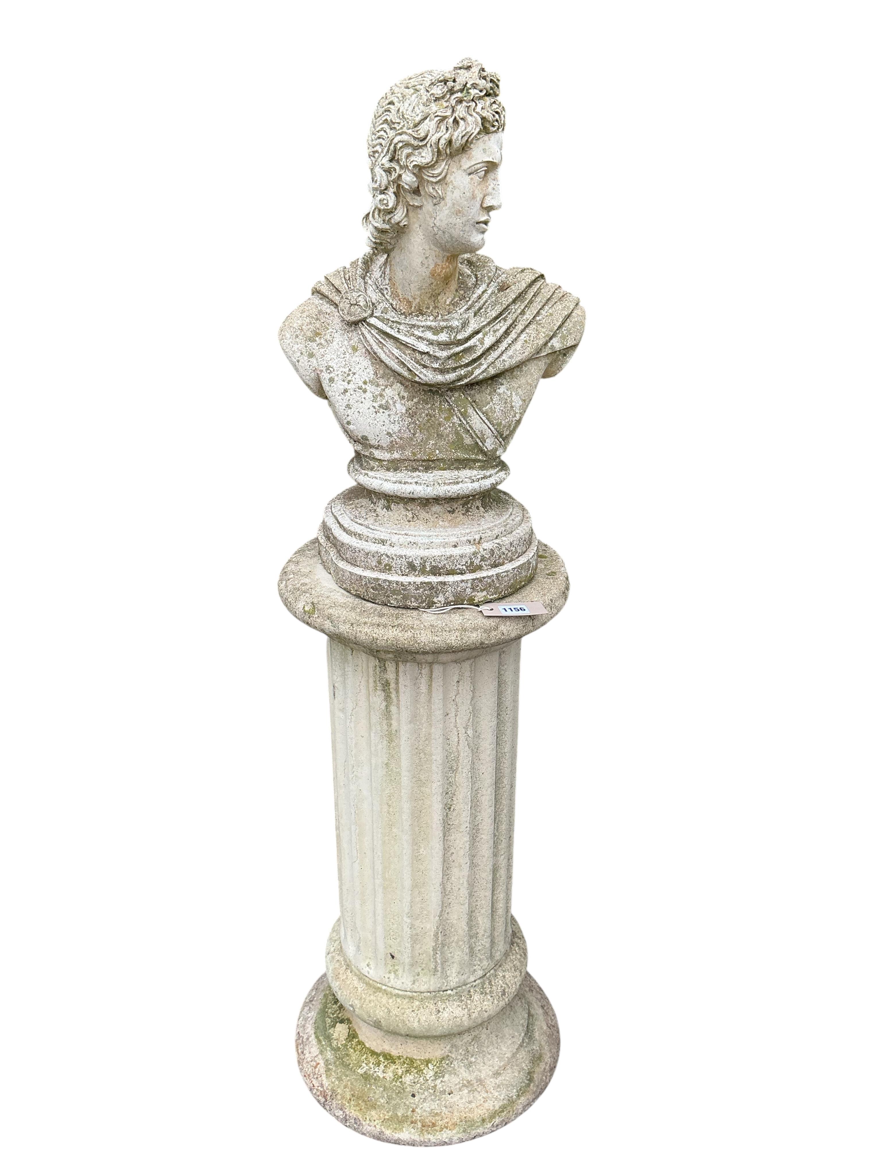 A reconstituted stone Roman style bust on fluted pillar, height 130cm